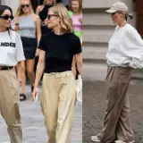 Stylizacje z beżowymi spodniami: jakie buty wybrać? Sneakersy i eleganckie sandały pasują do luźnych spodni.
