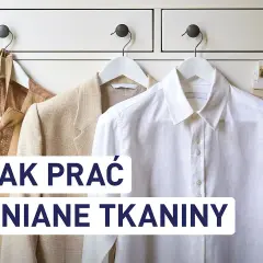 Jak prać len? Wieszak z lnianą koszulą i marynarkami.